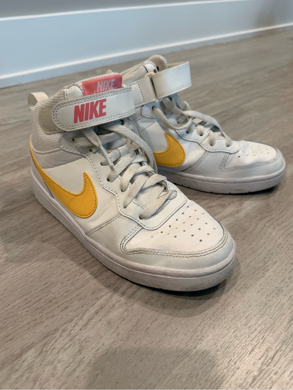 Nike Kids White High-Top Sneakers with Yellow Swoosh and Pink Logo